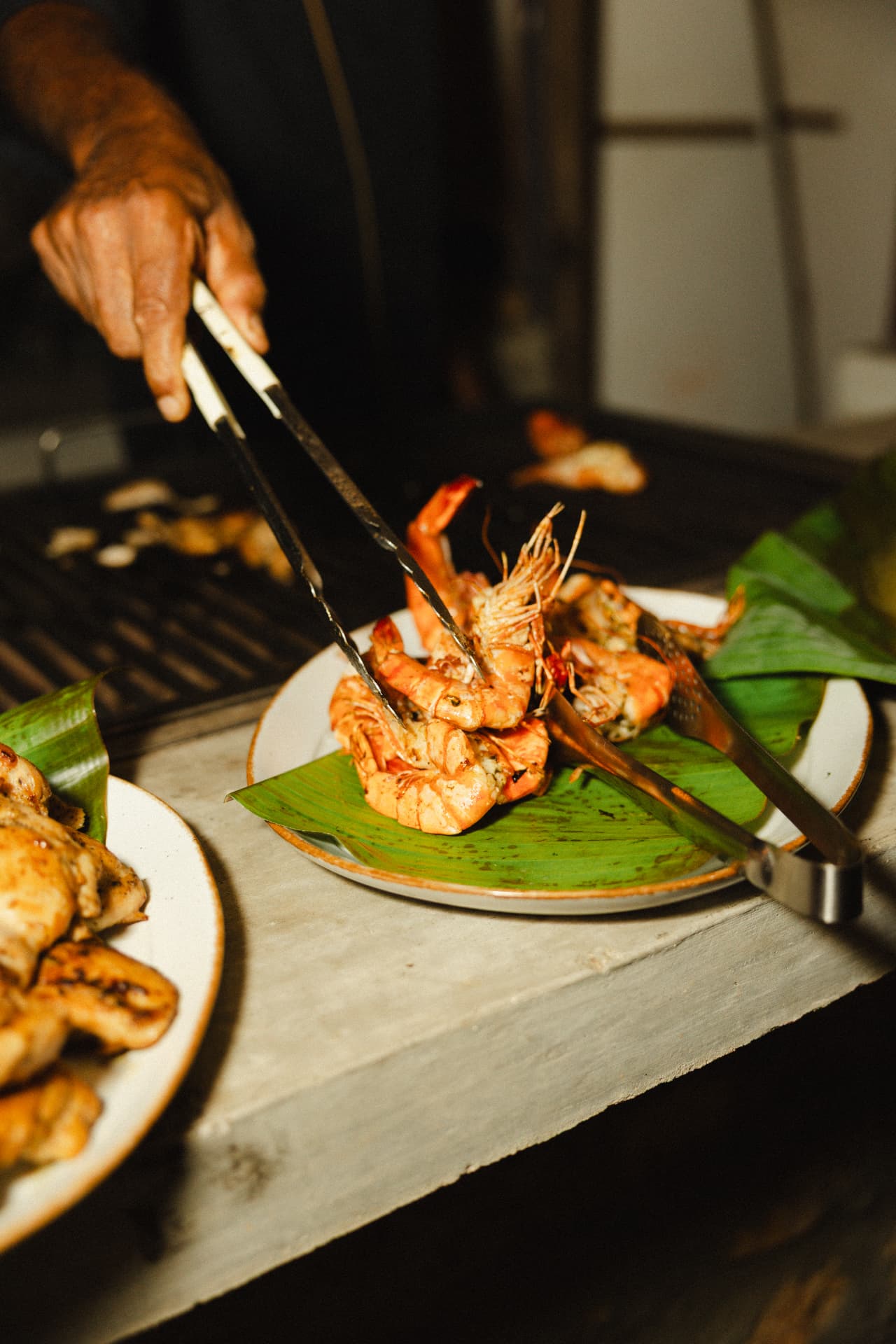 Freshly grilled prawns served on banana leaf