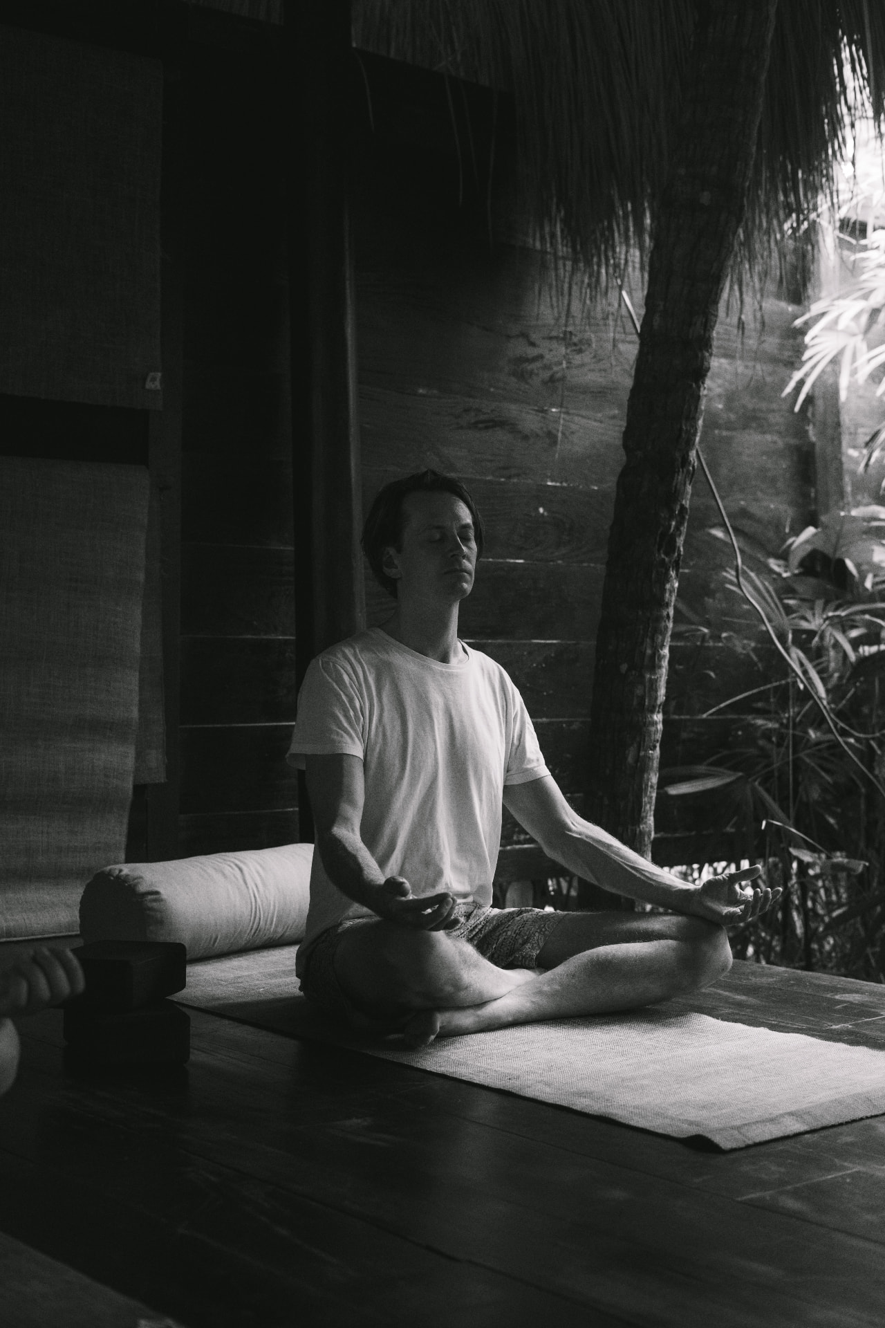 A guest sitting in meditation at the retreat shala