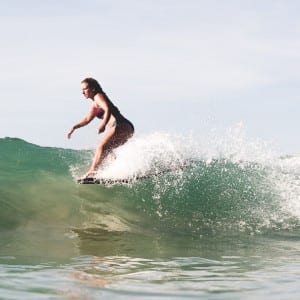 Jen surfing at Sunshinestories